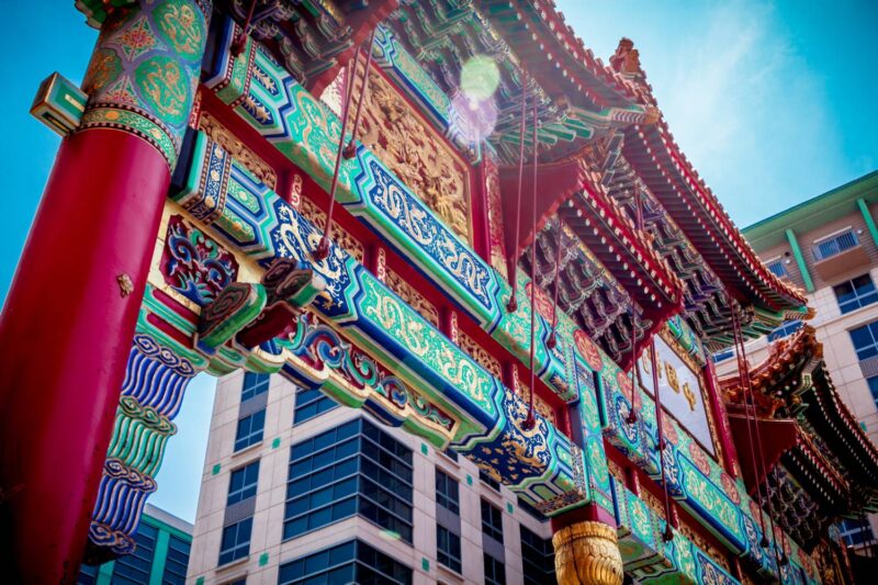 a tall building with colorful decorations on top of it